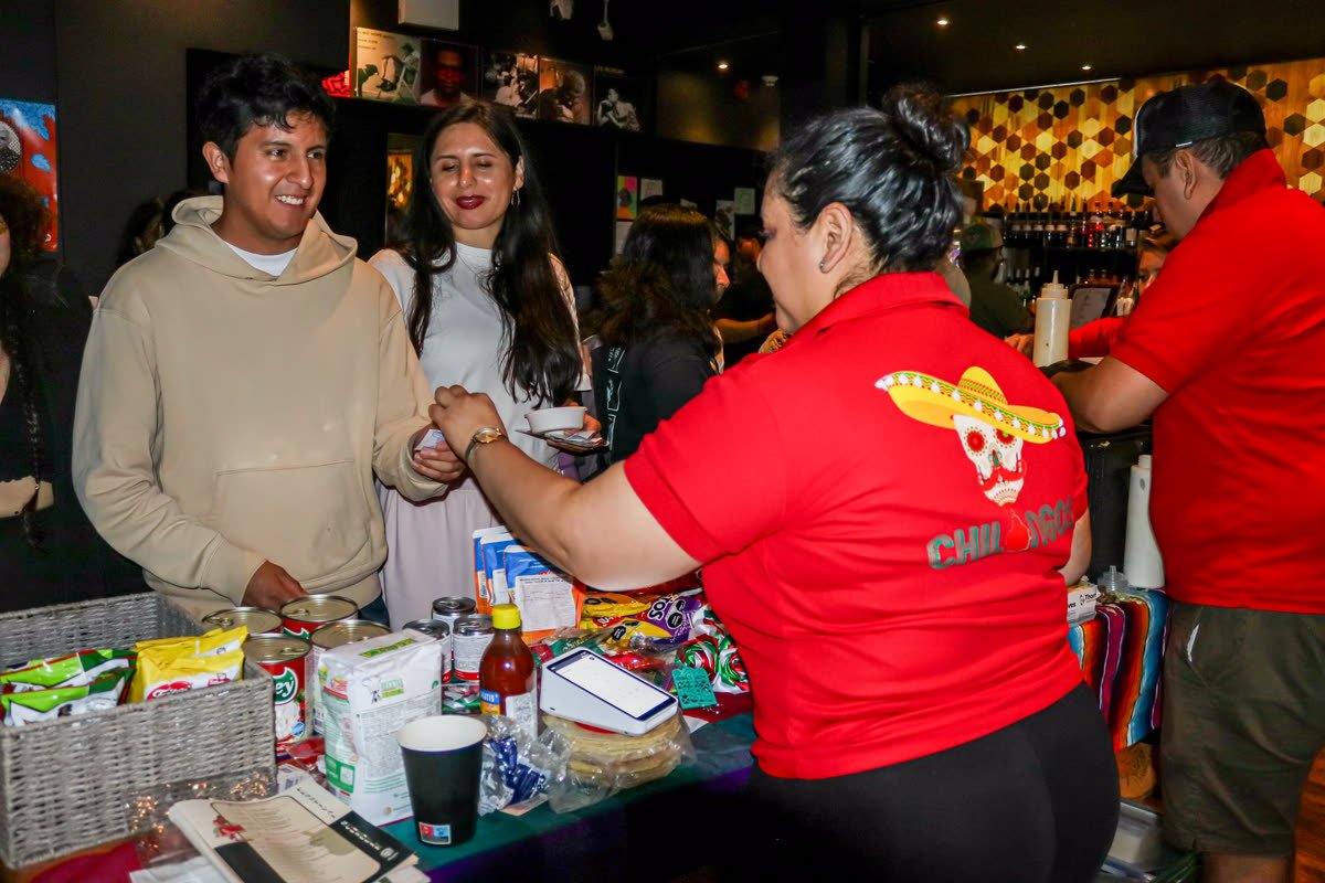 Chilangos catering staff serving guests