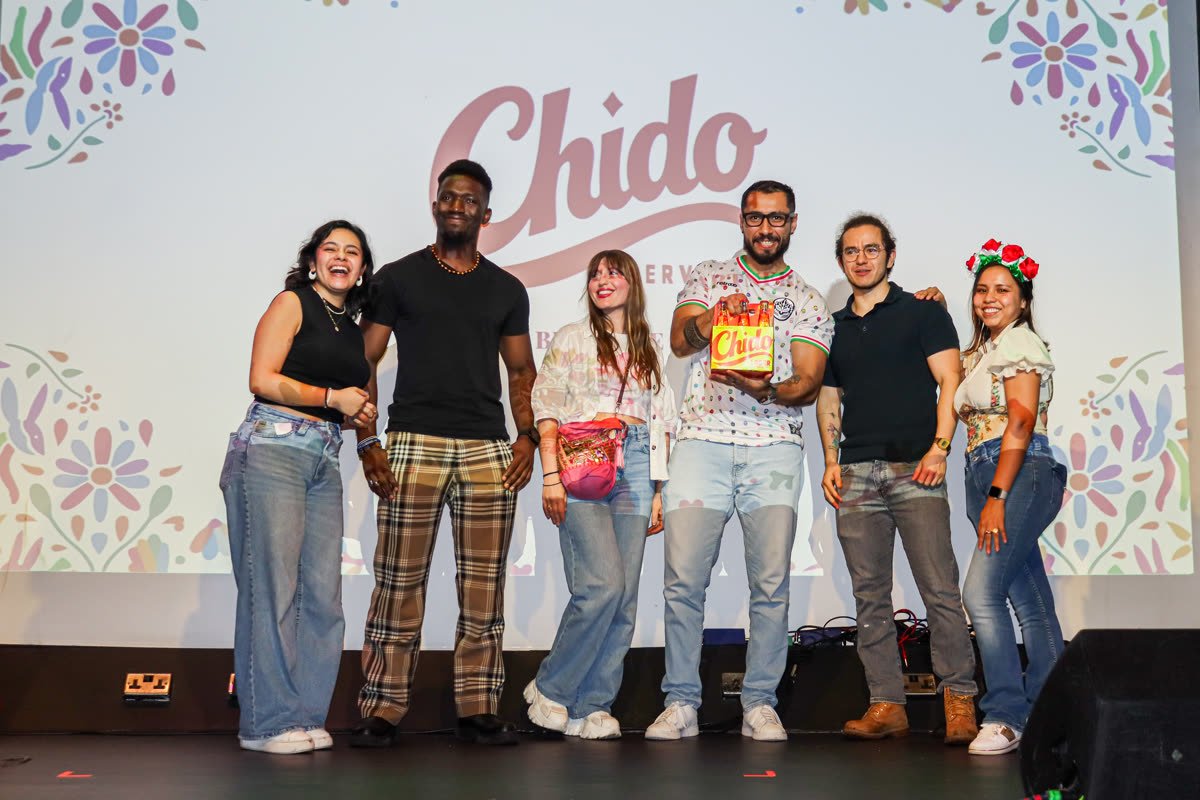 The Chido Beer team celebrating on stage