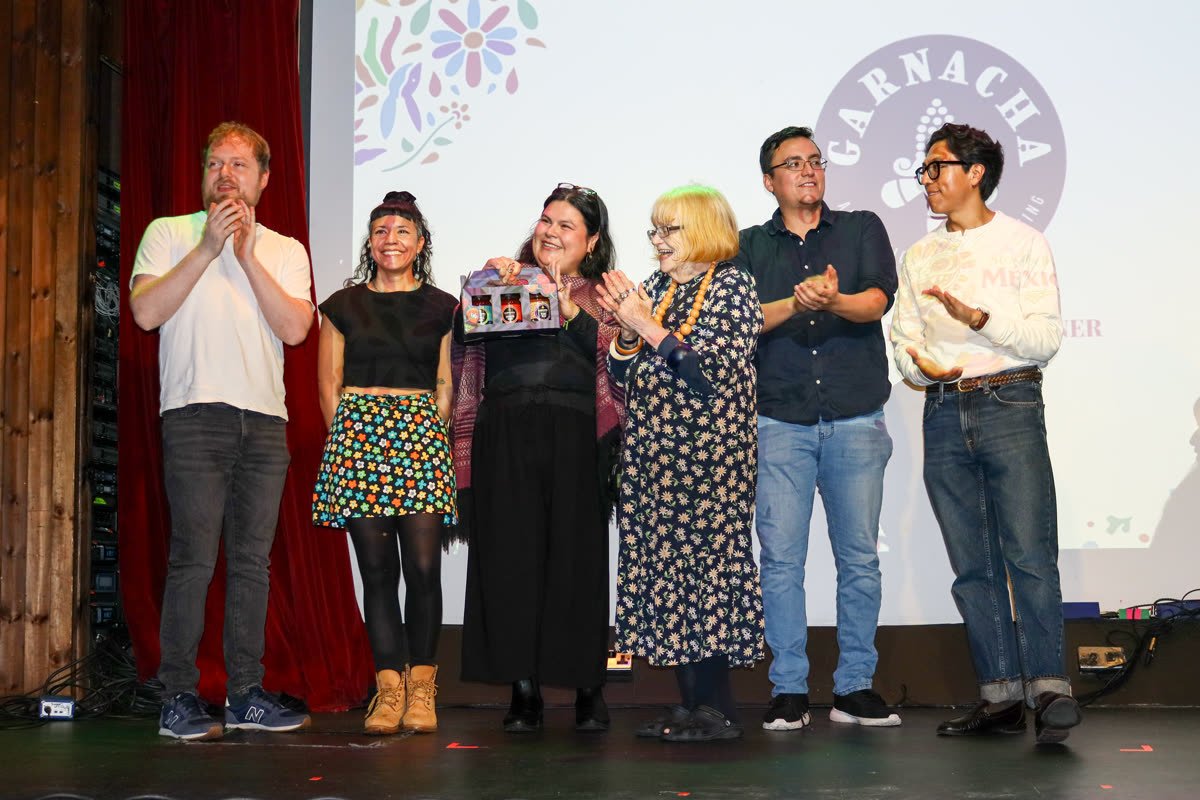 The Garnacha team receiving recognition on stage