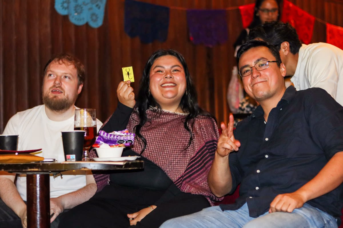 A guest holding a Lotería card during the raffle game